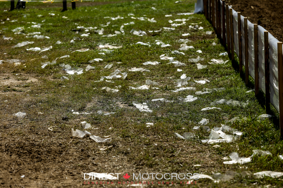 RIders come off the track and peel the rest of their tear-offs. They clean them up with a rake at the end of each day. 